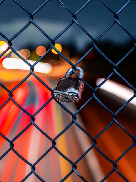 Close-up of chainlink fence against wall