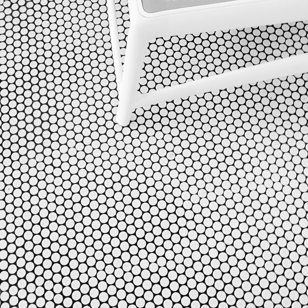 Photo close-up of chair on tiled floor