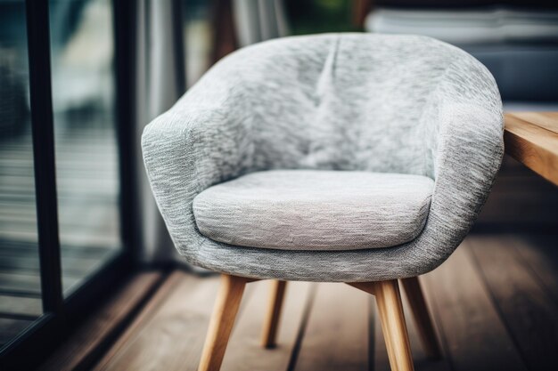 Photo a close up of a chair with a wooden base and a grey upholstered chair