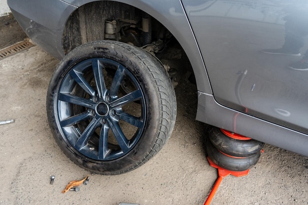 Close up of changing car tyre Car tire fitting