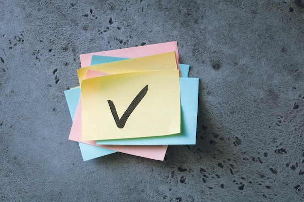 close-up of checked adhesive note