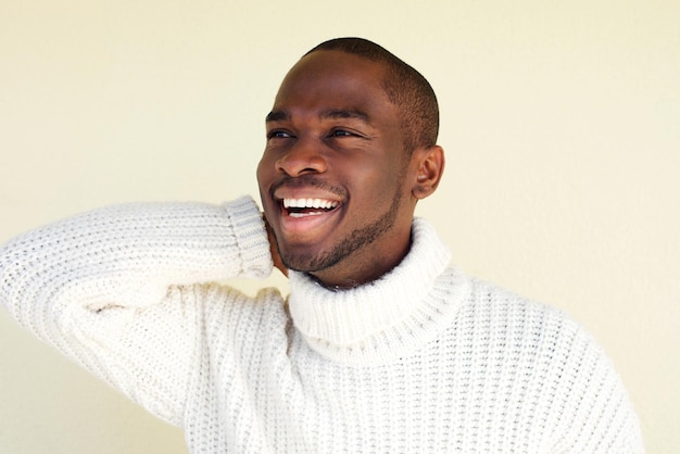 Close up cheerful african man laughing with sweater