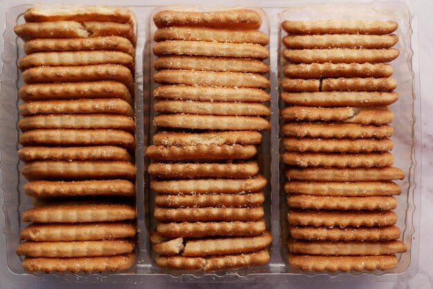 close up of cheese cookies in a packer on table