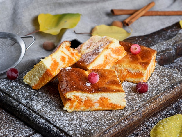 Close-up of cheesecake slices with kitchen knife on table