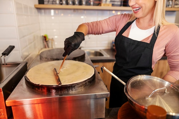 Close up of chef baking flapjacks at pancake house