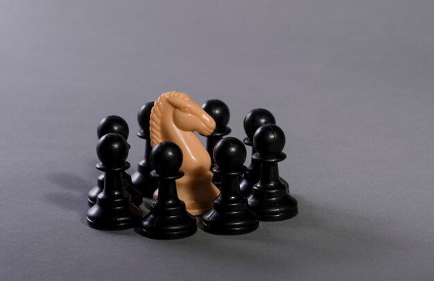 Close-up of chess piece against gray background