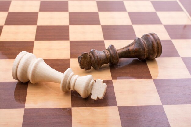 Close-up of chess pieces on floor