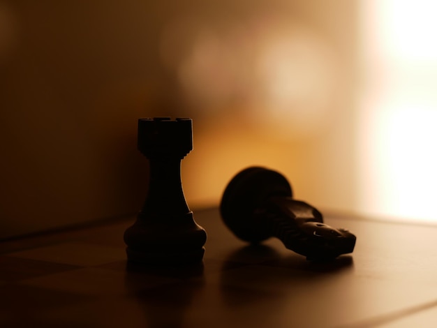 Close-up of chess pieces on table