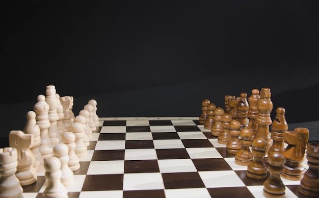 Close-up chess white pieces on board;