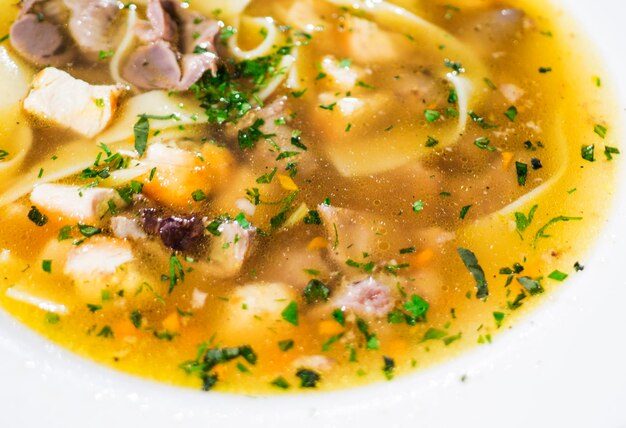 Close-up of chicken noodle soup served in bowl