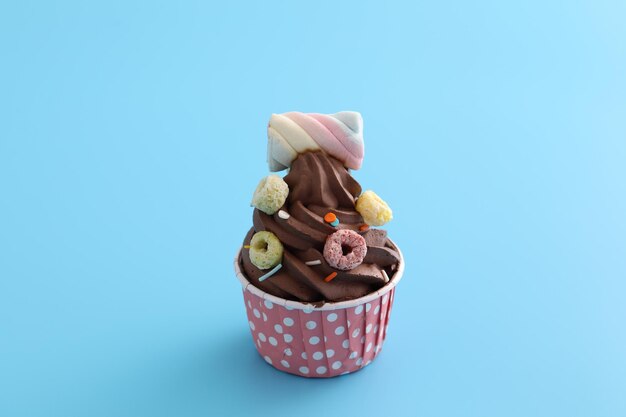 Close-up of chocolate cake against blue background