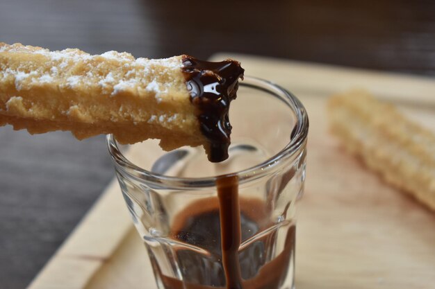 Close-up of chocolate in glass on table