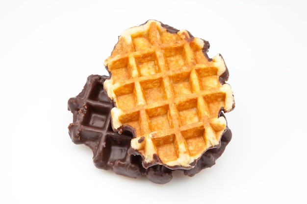 Photo close-up of chocolate waffles against white background