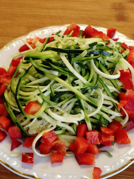 Close-up of chopped fruits in bowl on table