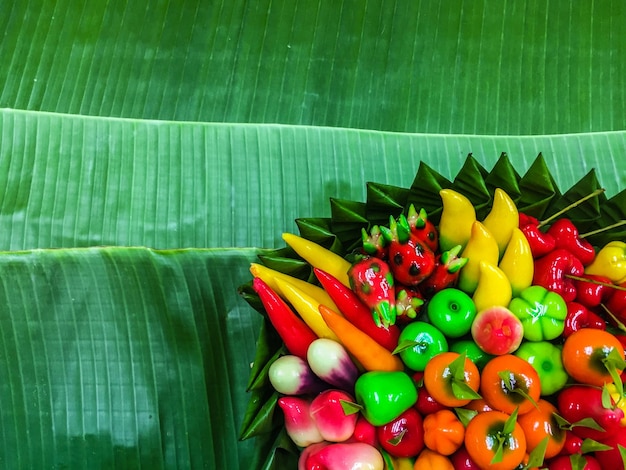 Close-up of chopped fruits on green leaves