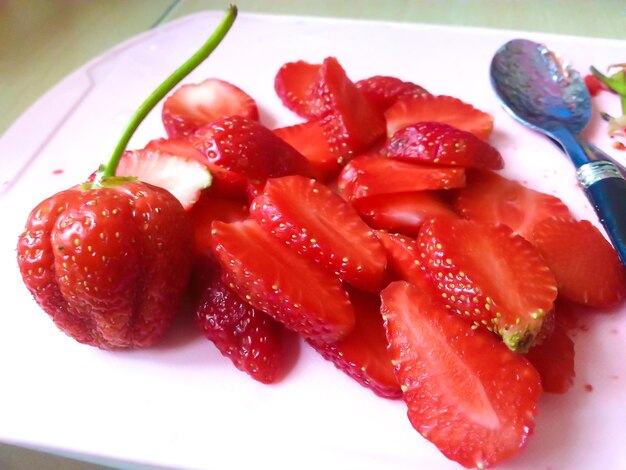 Close-up of chopped fruits in plate