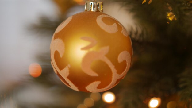 Photo close-up of christmas bauble hanging on tree