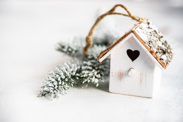 Photo close-up of christmas decoration by model home on snow during winter