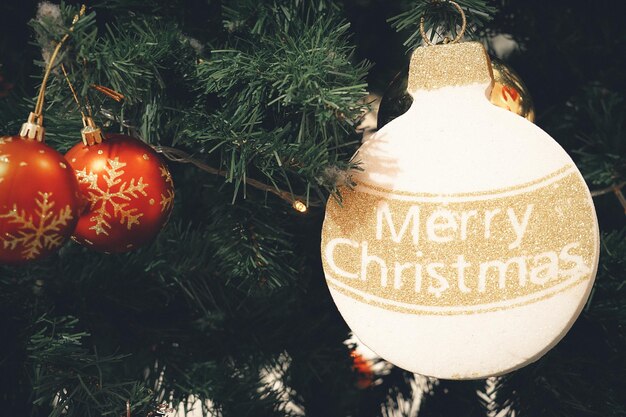 Photo close-up of christmas decoration hanging on tree