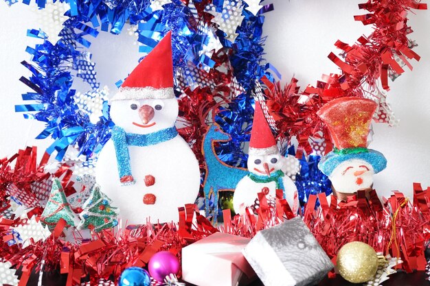 Close-up of christmas decoration on table against wall