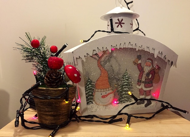 Photo close-up of christmas decoration on table at home