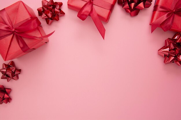 Close-up of christmas decorations against pink background