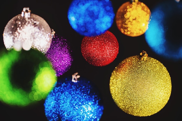 Photo close-up of christmas decorations over black background