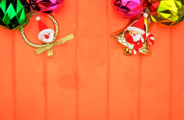 Photo close-up of christmas decorations hanging by wall