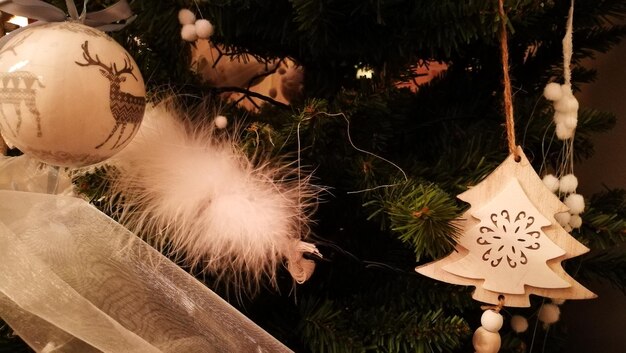 Photo close-up of christmas decorations hanging on tree