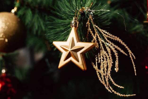 Photo close-up of christmas decorations hanging on tree