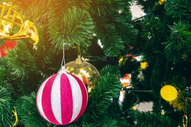 Close-up of christmas decorations hanging on tree