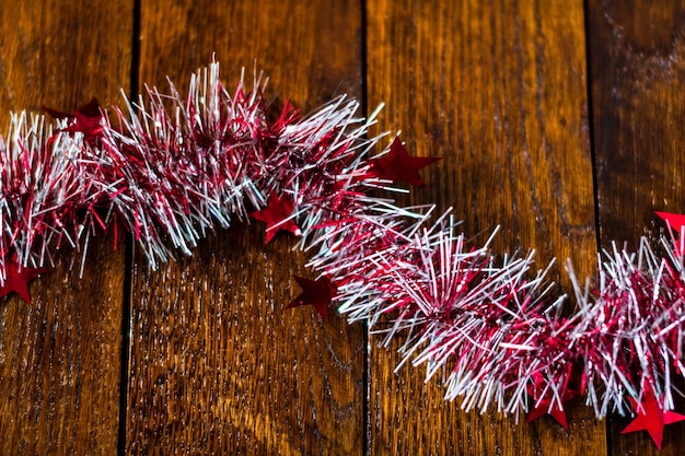 Photo close-up of christmas decorations hanging on wood