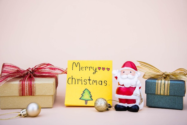 Close-up of christmas decorations and presents on gray background