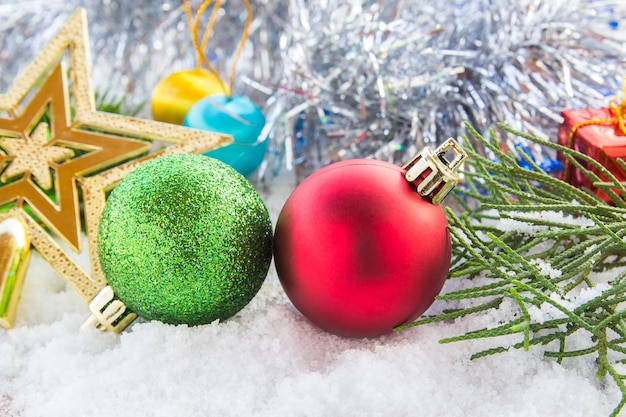 Close-up of christmas decorations on snow