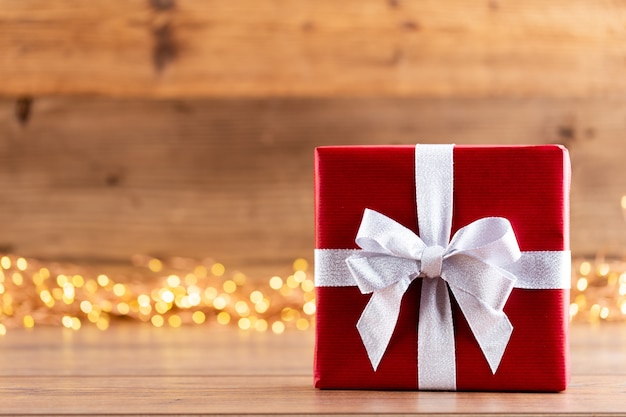 Close up christmas gift box on table