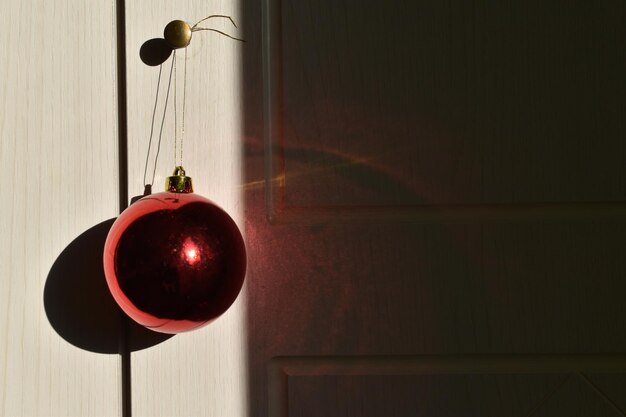 Photo close-up of christmas ornament hanging on door