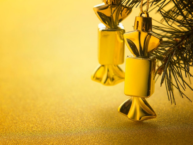 Close-up of christmas ornaments hanging on tree