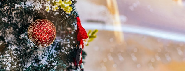 Photo close up of christmas tree with red ornament banner still life