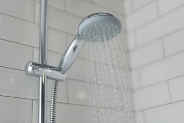 Photo close-up of chrome shower, faucet, in the bathroom