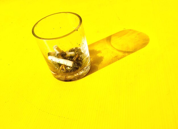 Close-up of cigarette on glass
