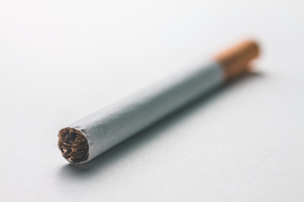 Close-up of cigarette on white background