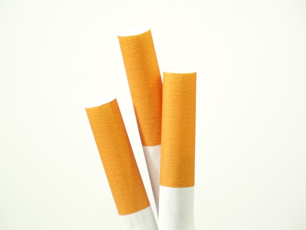 Close up of a cigarettes and the tobacco leaf that is in the cigarettes