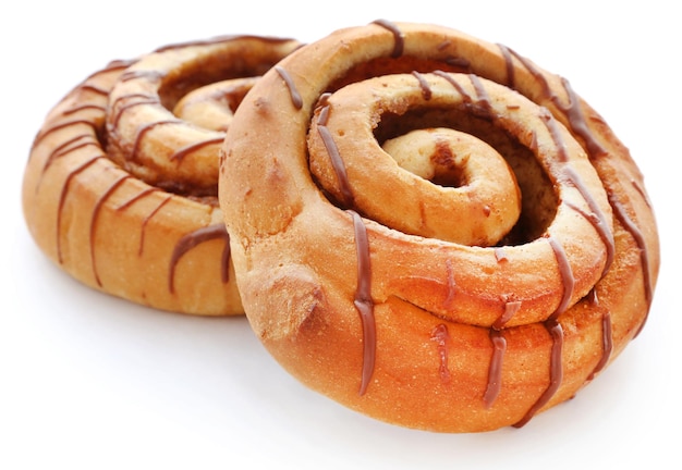 Close up of a cinnamon bun isolated against white background