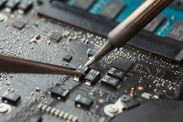 Close-up circuit board repair