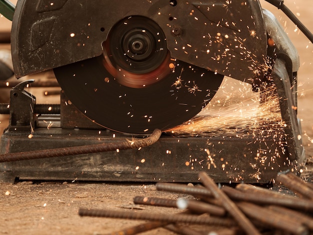 Photo close-up of circular saw cutting metal