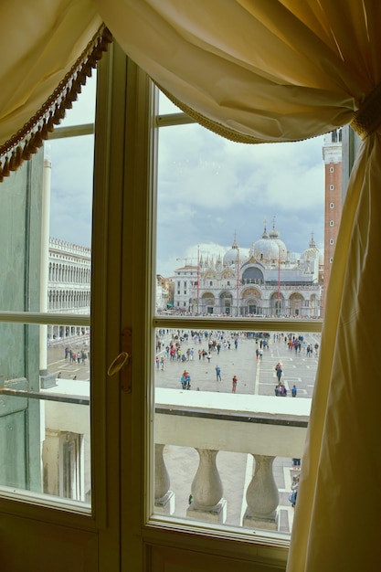 Close-up of cityscape against sky seen through window