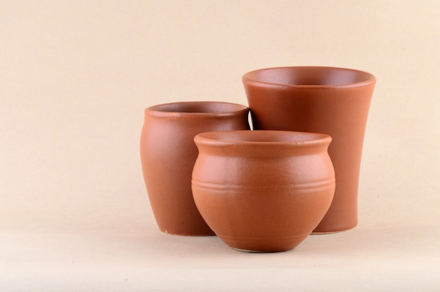 Close-up of Clay pots on cream