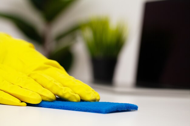 Close Up cleaning company worker hand holding sponge