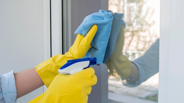 Photo close-up cleaning window with chemical spray