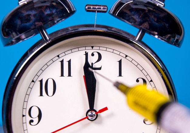 Close-up of clock against blue background